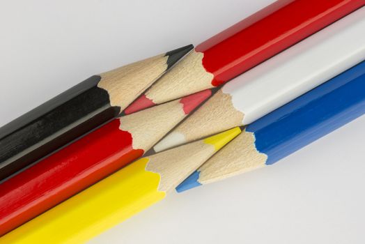 Collection of colorful pencils in German and Dutch flag colors as a background picture
