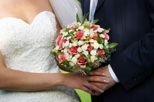The groom keep the bride for hands