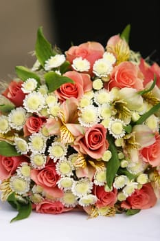 Wedding bouquet from roses on a dark background