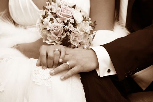 Hand of the groom and the bride with wedding rings