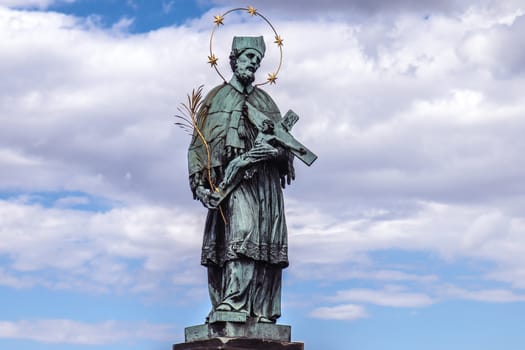 Prague, Czech Republic, 30 July 2016 - John of Nepomuk statue on the Charles Bridge