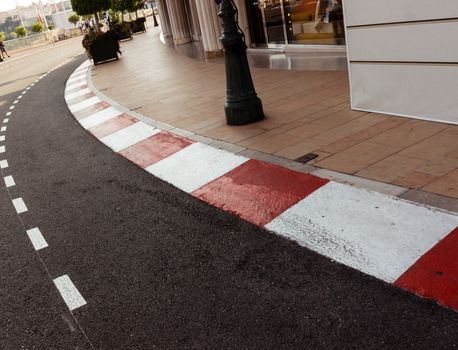 Car race asphalt and curb on Monaco Montecarlo Grand Prix street circuit.