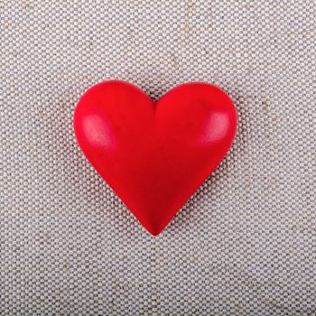 Red heart on a beige fabric