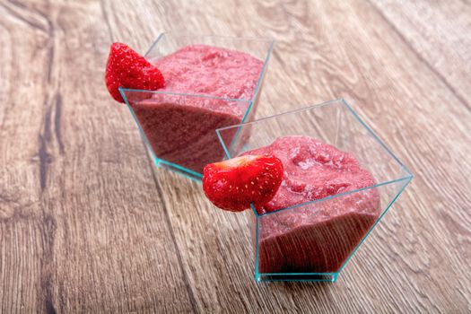 Strawberry puree, decorated with fresh strawberries