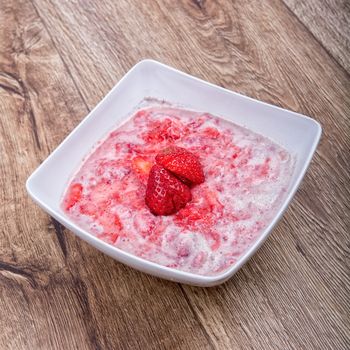 Strawberry puree, decorated with fresh strawberries