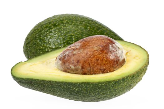Half  avocado with stone isolated on white background, close up