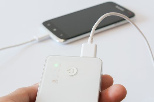 Smartphone is charging with power bank while it standby