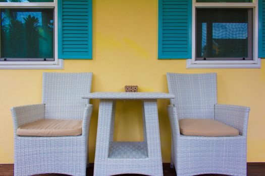 Two chairs on wooden deck. Modern outdoor furniture on wooden deck