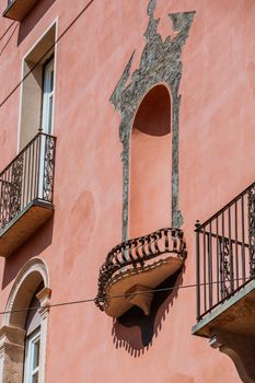 exterior of an old building window and balcony