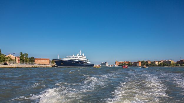  Boat floating from the island of San Giorgio, Venice, Italy