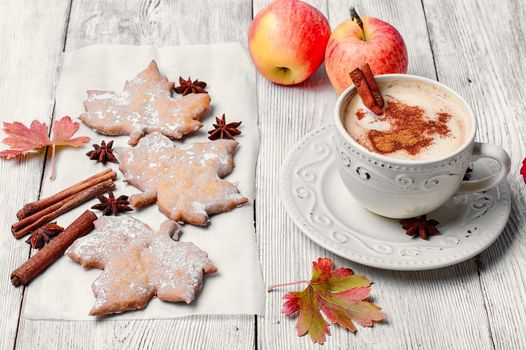 Cookies in the shape of maple autumn leaf and and coffee