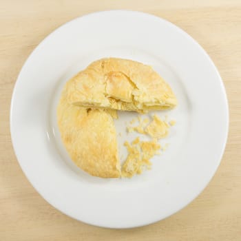 The Taiwanese sun cake (milk butter pastry) on the white plate.