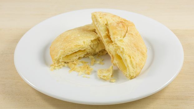 The Taiwanese sun cake (milk butter pastry) on the white plate.