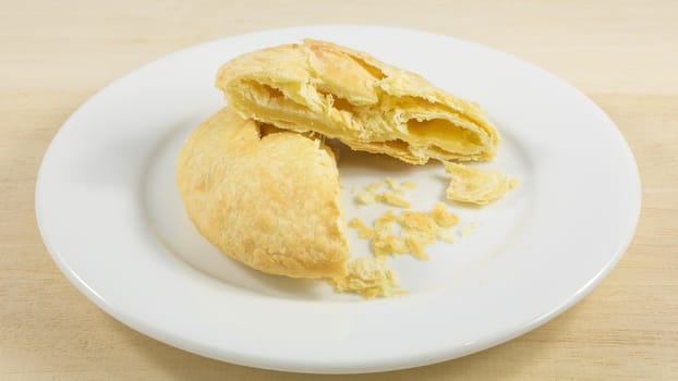 The Taiwanese sun cake (milk butter pastry) on the white plate.