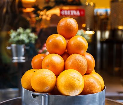 pyramid of oranges, beautiful and mature put on display