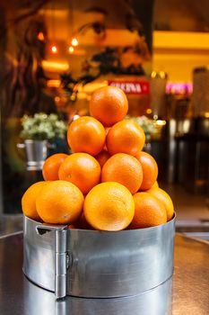 pyramid of oranges, beautiful and mature put on display