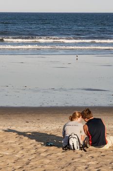 beautiful couple on the beach near the ocean