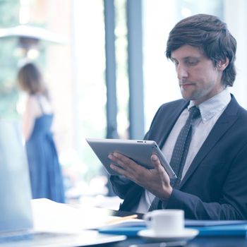 Business man with tablet computer in office