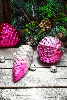 Old-fashioned russian glass Christmas decorations and fir branch