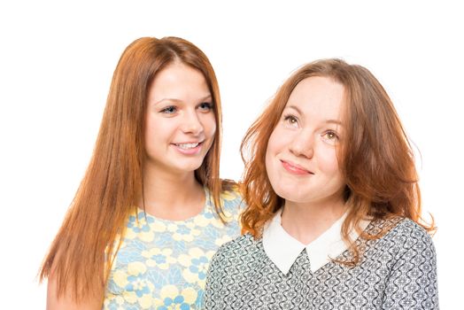 Portrait of two beautiful women friends isolated on white background