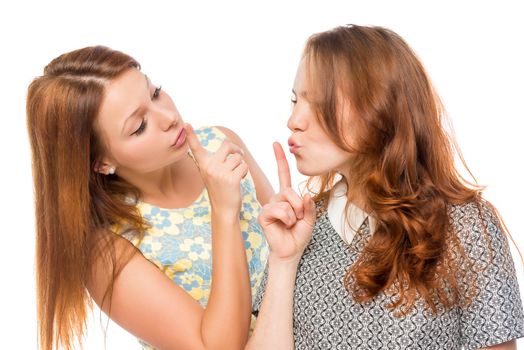 attractive girlfriends show gesture "quietly" on a white background