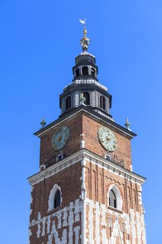  Town hall tower on main market square on blue sky background, Krakow, Poland.