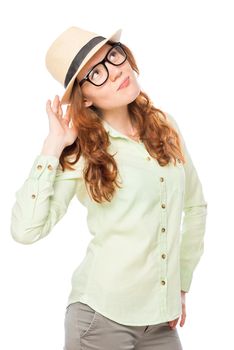 Vertical portrait of stylish girl in a hat on a white background isolated
