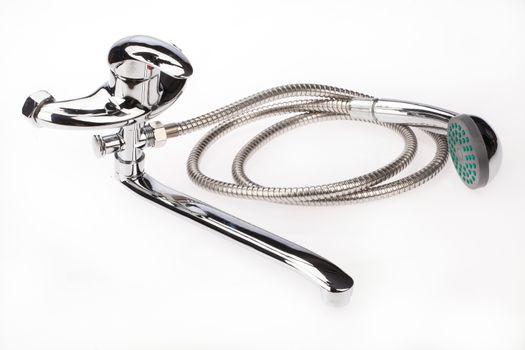 Metal chromium-plated water mixer on an isolated background
