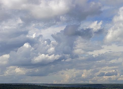 Panorama of large clouds against the blue sky.