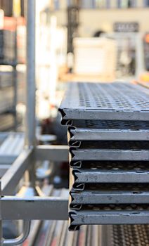 scaffolding disassembled and stacked after use at the construction site