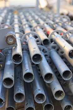 scaffolding disassembled and stacked after use at the construction site