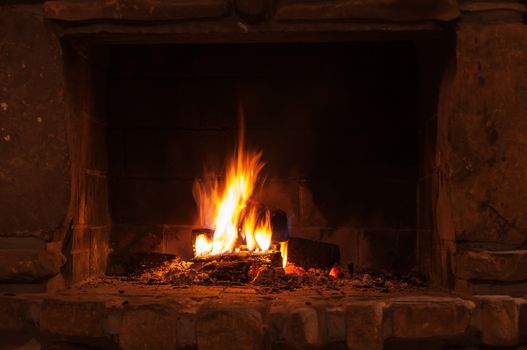 Burning pieces of wood in a fireplace