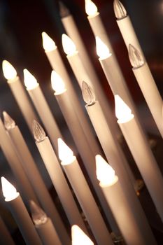 lighted candles in the cathedral of Pisa, Tuscany, Italy