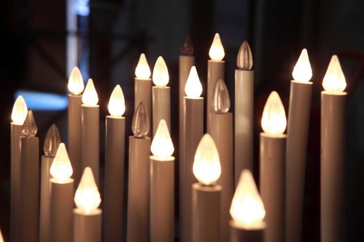 lighted candles in the cathedral of Pisa, Tuscany, Italy