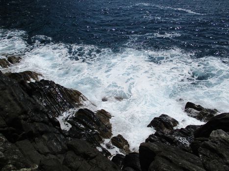 waves crashing on the rocks of the 5 lands, Liguria, Italy