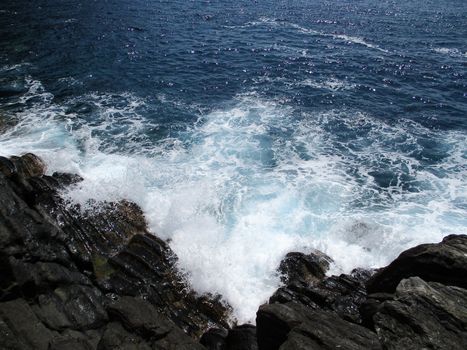 waves crashing on the rocks of the 5 lands, Liguria, Italy