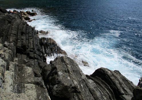 waves crashing on the rocks of the 5 lands, Liguria, Italy