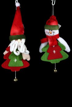 Christmas decorations to hang on the Christmas tree on a black background