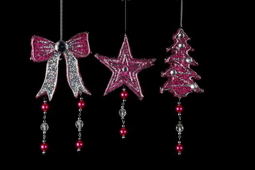 Christmas decorations to hang on the Christmas tree on a black background