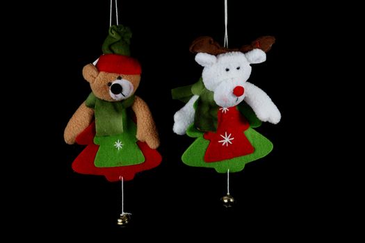 Christmas decorations to hang on the Christmas tree on a black background