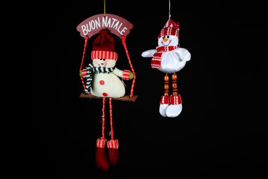 Christmas decorations to hang on the Christmas tree on a black background