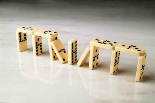 construction made with dominoes on a neutral background