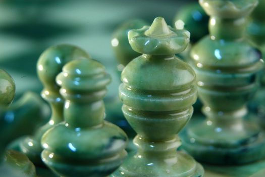 chessboard and alabaster chess on a black background