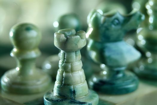 chessboard and alabaster chess on a black background