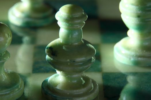 chessboard and alabaster chess on a black background