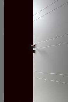 open white door on black background