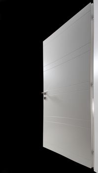 white wooden door open on black background