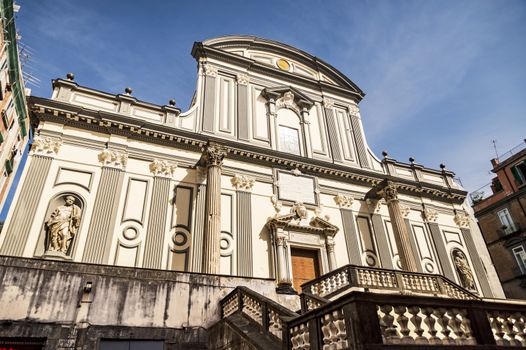 view of the facade of Basilica di San Paolo Maggiore San Paolo Maggiore Church on Via dei Tribunali in Naples, Campania, Italy.