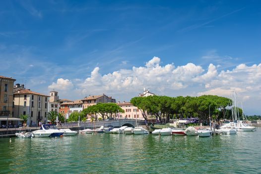 Desenzano, Lombardy, northern Italy, 15th August 2016: Small yachts and boats in harbor of Desenzano del Garda, lake Garda, Italy