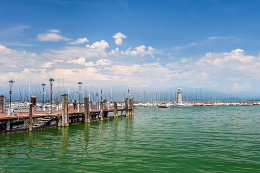 Desenzano, Lombardy, northern Italy, 15th August 2016: Small yachts and boats in harbor of Desenzano del Garda, lake Garda, Italy